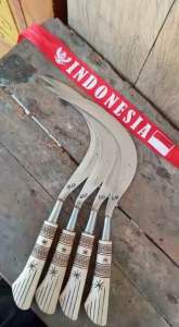 Arit Rumput Sabit Merek SS Gagang Ukir Asli Madura