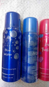 Love Fantasy Perfume Body Spray 2.02 oz / 60 ml. Pink and purple bottles with heart and flower designs. Perfect Guy fragrance.