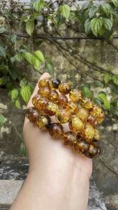 Vòng hổ phách hoa tự nhiên 13li.