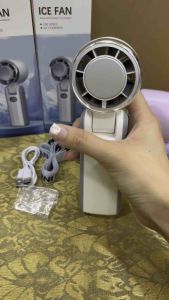 ICE FAN portable handheld fan with USB charging cord and lanyard in white purple and black colors.