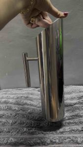 Stainless steel pitchers for catering and restaurant use three sizes cylindrical shape polished finish handles suitable for serving beverages.