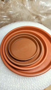 Orange Saucer Plate: A Pot Water Catcher Solution