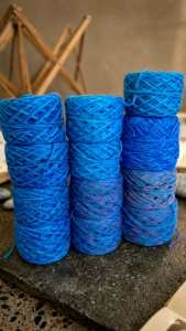 Blue yarn skeins for knitting and crochet projects. Four ply mixed blue yarn. Knitting and crochet supplies.