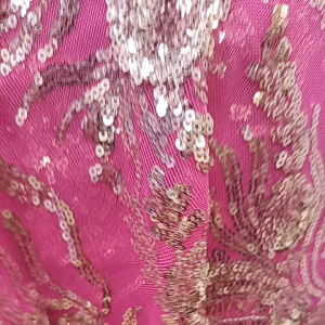 Sequins silver on fuchsia stretch mesh 60 inches width