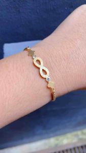 Gelang Tangan Serut Infinity Clover Pasir Titanium Gold Cxb2715