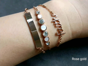 DaVee gold plated crystal jewelry shell bracelet with "blessed" charm white and clear stones gold bar casual wear.
