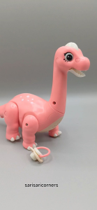 Electric pink dinosaur toy with features for ages 3+
