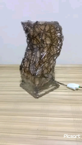 Handcrafted Spiral/Rectangular/Cylinder table lamp with warm glow intricate woven design rectangular shape wooden base suitable for indoor decor.
