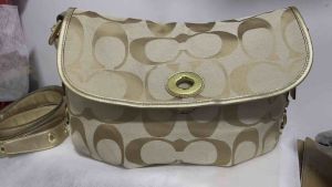 preloved authentic signature flap turnlock canvas convertible sling or hobo bag