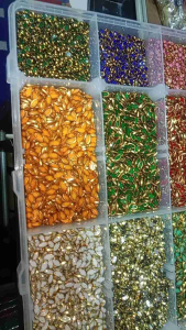 Gold border kundan in various shapes and colors.