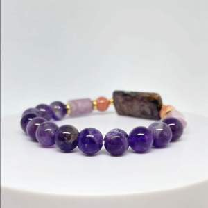 MEG Violet Muse Composition bracelet with amethyst lepidolite rhodochrosite and charoite beads.