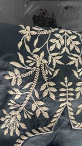 Dark green embroidered kurta with floral patterns and long sleeves.