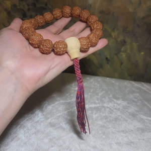 Rare large size 19mm small species "Dragon Scales" Rudraksha Tibetan style 18 mala beads handheld bracelet with an "Ivory Fruit (Tagua)" carved dragon guru bead and a handmade Tibetan cotton threads tassel