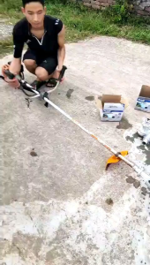 đầu bơm nước gắn máy cắt cỏ