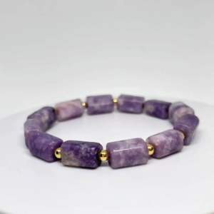 MEG Lepidolite Rhythm Line bracelet with purple rectangular beads and gold accents.