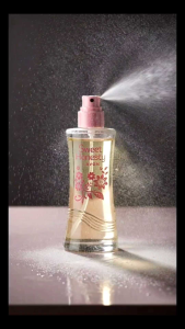 Avon Sweet Honesty perfume spray bottle with floral design and pink cap.
