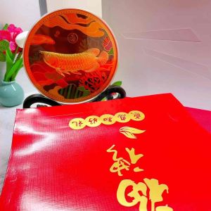 Fortune Bliss Feng Shui Golden Arowana Lucky Charm Ornament Circular design with golden fish colorful aquatic background decorative stand