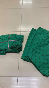 GSP SCOUTING SHORT SCHOOL UNIFORMS FOR GIRLS REPELLANT IN FABRIC - Green shorts with black patterns size chart provided suitable for school uniforms.
