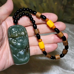 67 grams Premium Nephrite green with caramel brown Laughing Buddha Jade handheld/large pendant (with certificate) 67克优质且末和田玉绿带糖笑佛弥勒佛手把/大吊坠(带证书)