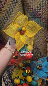 Native Poinsettia with Bling2x yellow mesh flower with green and red accents held in hand