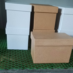 Rectangle hard box 6x4x4 inches for stationery packaging. Brown cardboard lid flat surface simple design durable. Suitable for gift cards or small craft items. Placed on green mesh surface.