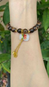 Vòng tay trầm hương sánh mix charm túi tiền