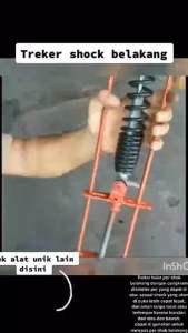 Alat Pelepas Per Shock Belakang Treker Sok Belakang