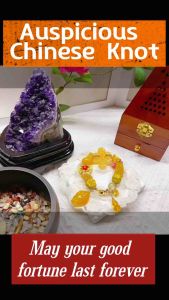 Yellow Beaded Bracelet with Flower Charm on Wooden Stand with Floral Background