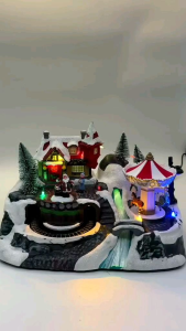 CHRISTMAS VILLAGE WITH CHANGING COLOR RIVER ROTATING TRAIN AND CAROUSEL DISPLAY
