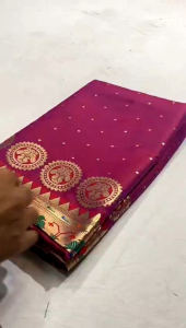 PREORDER LADIES ETHNIC TRADITIONAL SAREE WEAR FOR ALL OCCASION WITH COMFORTABLE MATERIAL. Blue saree with gold and red border green and gold pallu worn outdoors on grass.