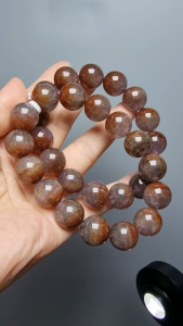Auralite 23 Beaded Bracelet with Four Colors Crystal - Brown Purple Red Clear - Worn on Wrist - Displayed with Raw Crystal
