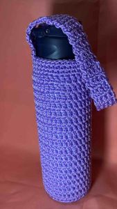Handmade purple crocheted water bottle sleeve with strap.