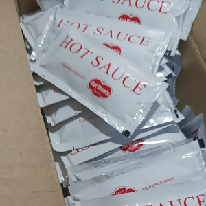 Del monte Hot Sauce 7g - White packets - Red text - Condiment - Cooking sauce