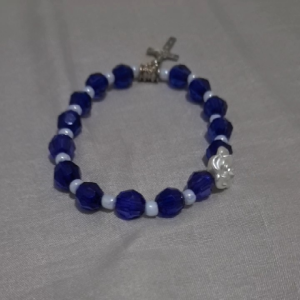 Blue and white beaded rosary bracelet with silver crucifix charm.