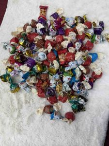 Bonchic Chocolate assorted wrapped candies in red blue purple and white packaging.