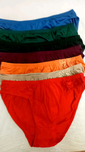 AVON VENUS & VIOLA BIKINI 7N1 PANTY PACK - Orange bikini bottom with lace detail displayed with six additional folded panties in beige red blue green purple and dark green.