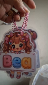 Personalized Kawaii Chibi Laminated Name Keychain with colorful cartoon characters and names: Sophia Mhavic Jacob Bea Clarisse Sally.