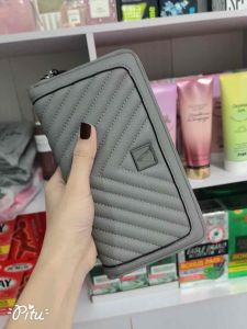 Túi cầm tay hiệu pink xám tro xin sò mềm sang trọng đẹp thời trang