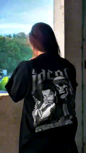 Black IDL-Street Wear t-shirt with graphic design. Ideal shoppers text on front. Skull and woman graphic on back. Fits mens tops category. Available in sizes S-M-L-XL.