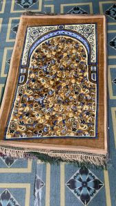 Sejadah baldu gebu with intricate floral patterns in multiple colors including red green beige and grey. Suitable for prayer and home decor.