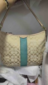 Like new preloved authentic signature green stripe hobo bag