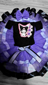 Purple and black tutu dress with cartoon character applique and floral accents.