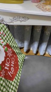 Creative cartoon Christmas chair cover decoration item with double-sided printing of an old man a snowman and bells.