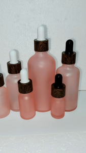 Frosted Pink Glass Bottles with Darkwood Print Dropper