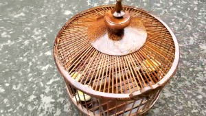 Lồng cu gáy gỗ mun tặng kèm cầu cóng móc áo nậm.