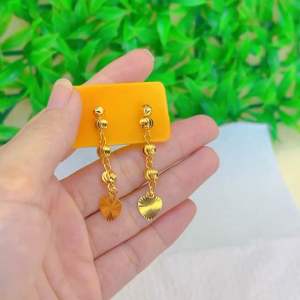 Sleek & modern: single small ball Drop earring with metallic sheen