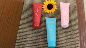 Avon Imari Body Lotion Freedom (blue) Naturelle (pink) Queen (red) with floral design.