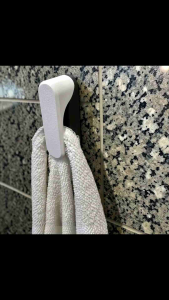 Gravity Towel Holder Towels slide in and out without damage. Elegant sturdy and perfect for bathrooms kitchens or workplaces. No nails—strong adhesive holds tight. Clean surface before sticking.