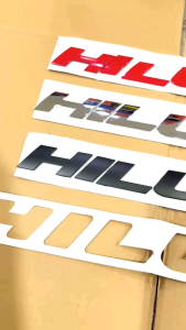 Emblem Hood Kap Mesin Mobil Hilux Hitam Merah Chrome