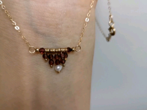 DaVee 14k Gold filled necklace with red garnet tassel and fresh-water pearl pendant.